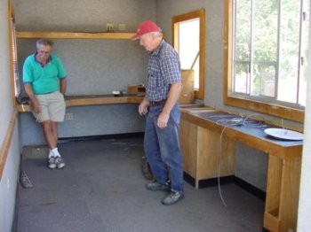 Inside of the mobile eco lab with Ivan Mish and another person.